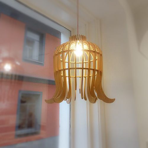a plywood pendant lamp shaped as a flower is a creative and modern piece for your interior