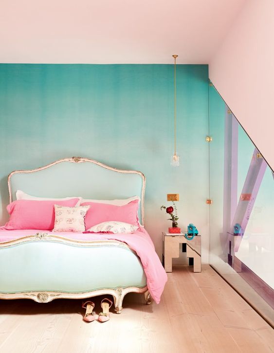 a refined bedroom with an ombre green accent wall, a refined and chic mint bed with pink bedding, a metallic nightstand