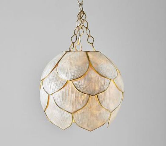 a refined flower-shaped pendant lamp on chains will bring an exquisite feel and chic to the space