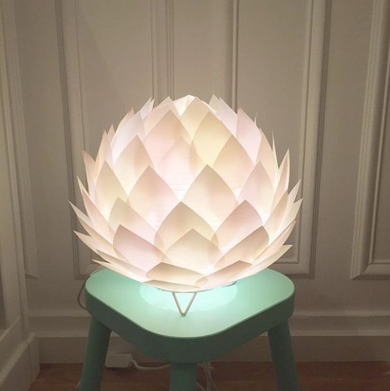 an oversized blush flower shaped table lamp on small legs is a gorgeous statement for your interior