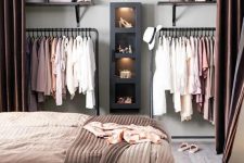 hide your closet in the bedroom behind curtains and make it invisible whenever you want