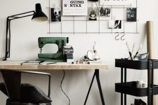 a Nordic industrial home office with a trestle desk, a metal chair, a Raskog cart, a grid with various stuff hanging
