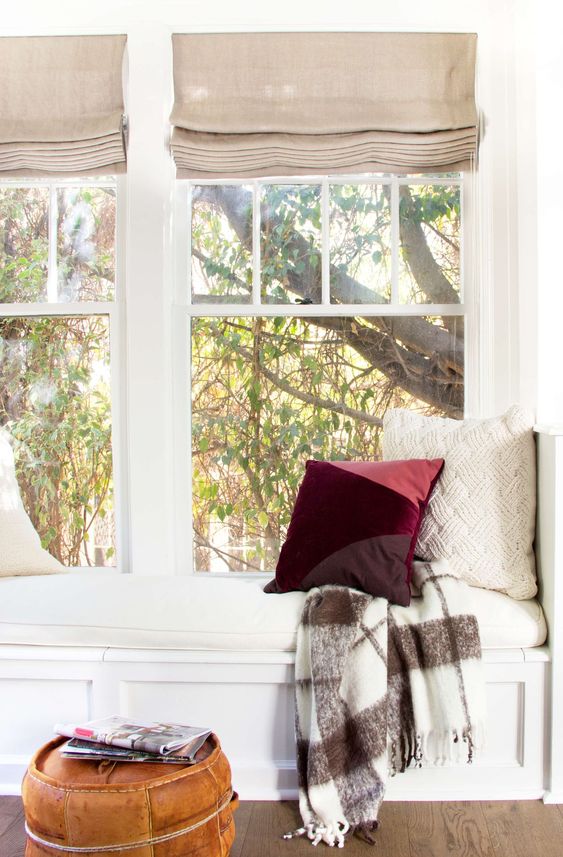 a color block burgundy, coral and purple pillow for adding a slight fall touch to the space