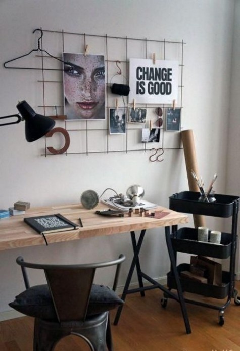 a contemporary meets industrial home office with a wire holder, an IKEA Raskog cart, a metal and wood desk plus a metal chair