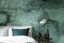 a dark green watercolor accent wall is a great statement in this bedroom, add a matching piece like a pillow here