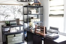 a modern meets industrial home office with metal lamps and chandeliers, metal shelving units, a woodden desk and a jute rug