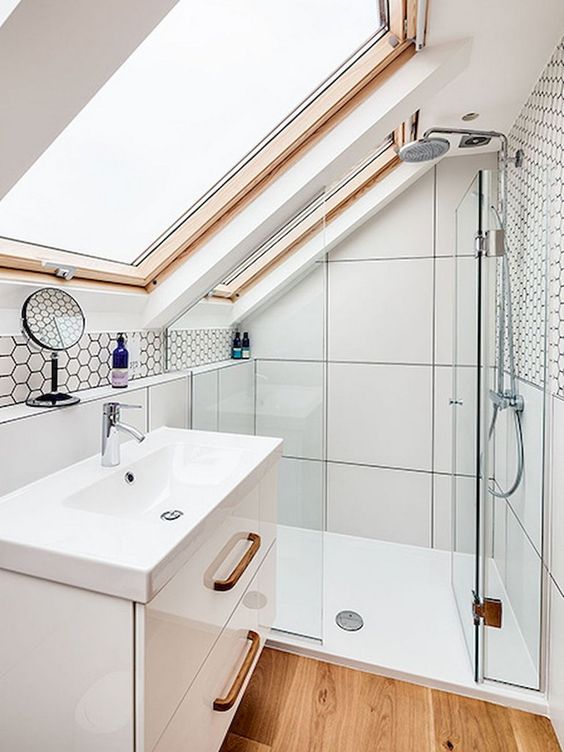 a tiny contemporary bathroom in neutrals with wooden touches, large scale tiles and a floating vanity plus hex tiles