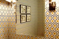 an elegant vintage-inspired bathroom decorated with hexagon print with gold inside wallpaper that brings chic to the space