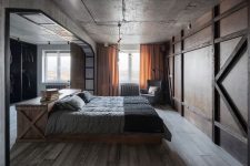 an industrial bedroom with a concrete ceiling and walls, a large wardrobe with a sliding wooden door, a wooden bed with grey bedding and yellow curtains