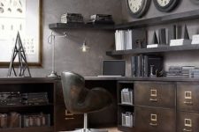 an industrial home office with a large storage and working unt of metal, wooden shelving, a leather chair and metal lamps