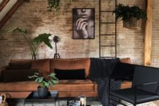 an industrial look is achieved with brick walls, metal coffee tables and a ladder