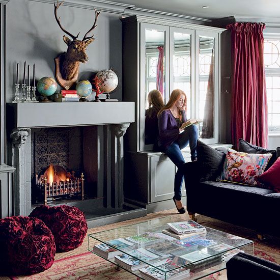 burgundy curtains and floral poufs are great accessories for a fall living room