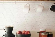 eye-catchy geometric tiles on the kitchen backsplash look chic and interesting