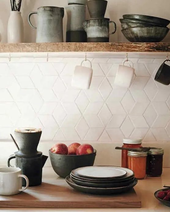 eye catchy geometric tiles on the kitchen backsplash look chic and interesting