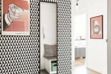 monochrome geometric wallpaper in the entryway for an eye-catching touch and a pattern touch in the space