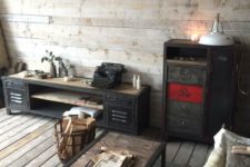weathered wood floor and walls, an industrial wood and metal coffee table, vintage metal furniture