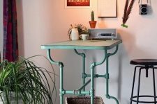 a beautiful industrial desk of aqua-colored pipe legs and a light-stained wooden desk is a pretty idea for a modern home office, and a touch of color
