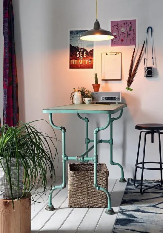 a beautiful industrial desk of aqua-colored pipe legs and a light-stained wooden desk is a pretty idea for a modern home office, and a touch of color