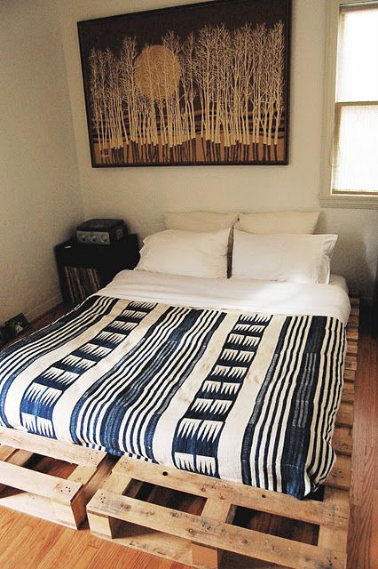 a bed made of pallets, with a mattress right on them is a fast and easy solution for an industrial or boho bedroom