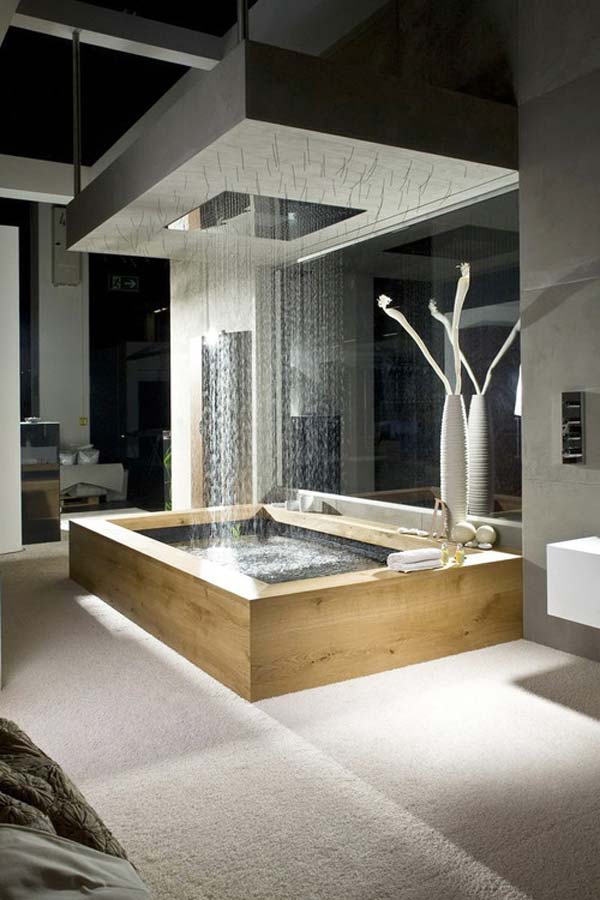 a contemporary bathroom with a rectangular shaped bathtub and a large rain shower over it plus built in lights