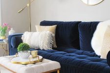 a simple modern living room design with a navy sofa