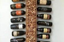 a vertical shelf with wine corks is a creative idea to embrace a home wine bar