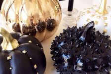 black and copper pumpkins decorated with spikes, studs and beads look very bold and cool