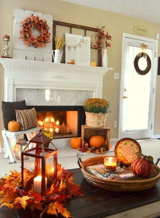 bright fall leaf arrangements, orange pumpkins and fall blooms bring a strong fall feel to the space