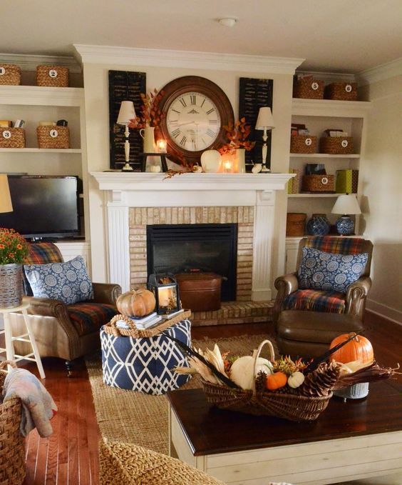 fall leaf arrangements and a basket with pumpkins, feathers and pinecones plus some fall blooms in a bucket