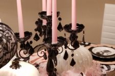 glam Halloween styling with white pumpkins, a black candelabra with pink candles and lace