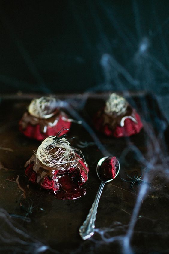 red velvet molten lava cakes with chocolate ganache and spun sugar on top for a Halloween party