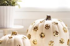 white pumpkins decorated with gold sequin polka dots are perfect for both fall and Halloween decor