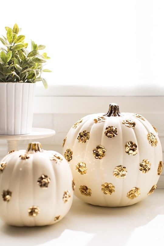 white pumpkins decorated with gold sequin polka dots are perfect for both fall and Halloween decor