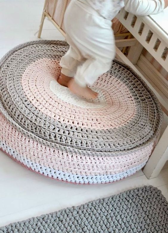 a pretty pastel-colored crochet pouf liek this one will be a favorite not only in a kid's room but also in many other spaces, too