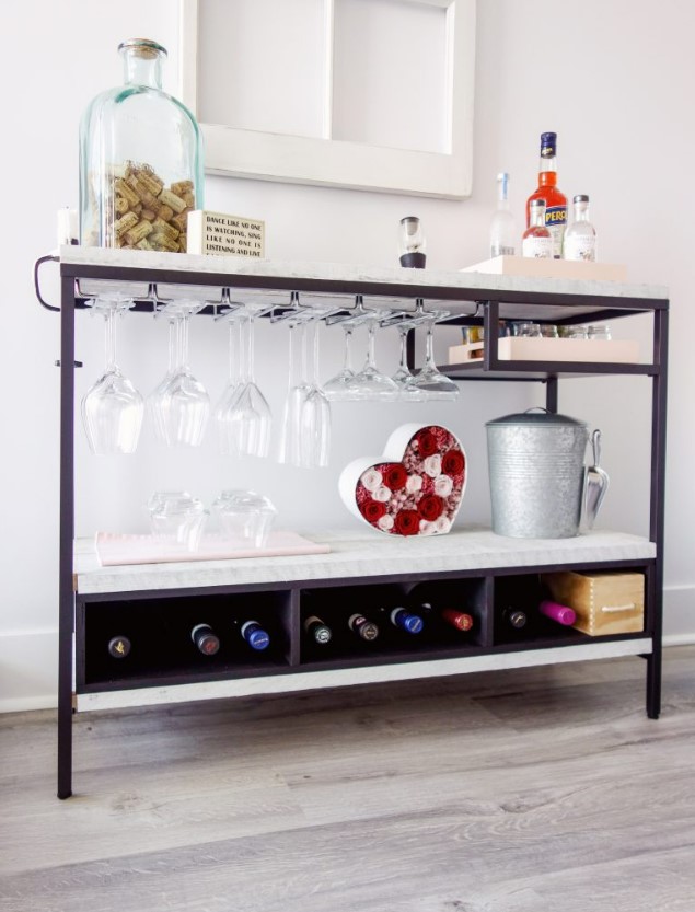 an IKEA Vittsjo hack into a stylish home bar with marble contact paper that covers plywood