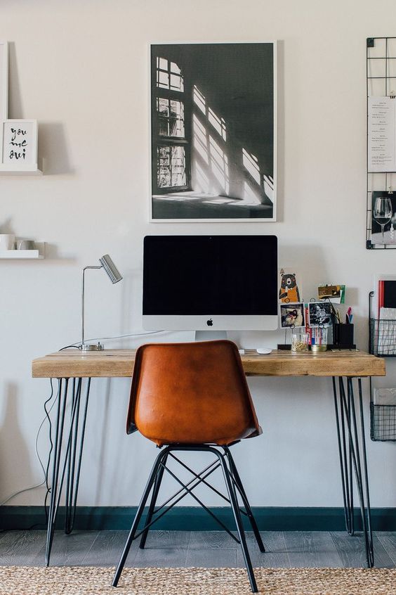 an industrial home office with a stylish desk - with hairpin legs and a wooden desktop is a cool idea for many home offices