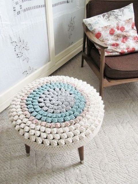 make your simple stool colorful and very soft covering it with a pretty and bright crochet piece like here