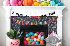 rainbow pumpkins, colorful balloons, bright tassle ghosts and a garland for Halloween