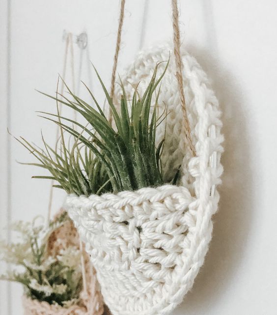 spruce up your home in a boho way with these neutral crochet plant pockets - these should be air plants or just faux ones