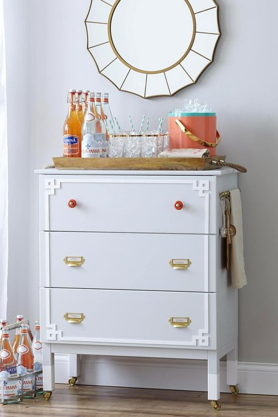 this IKEA Tarva dresser is adapted into a functional moveable entertaining station or bar with cool knobs and handles