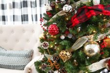 a bright and cool Christmas tree decorated with plaid and metallic ribbons, red, silver and gold ornaments, pinecones and faux berries