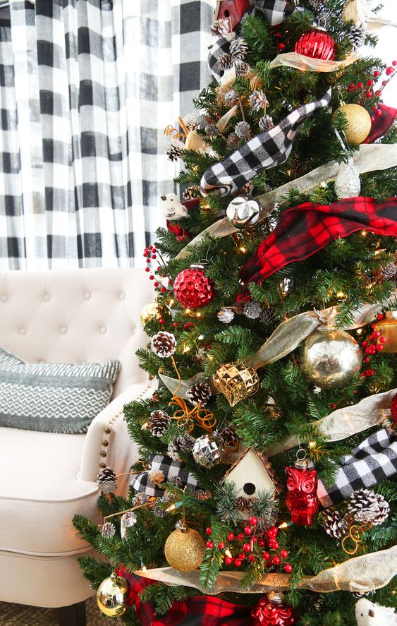 a bright and cool Christmas tree decorated with plaid and metallic ribbons, red, silver and gold ornaments, pinecones and faux berries