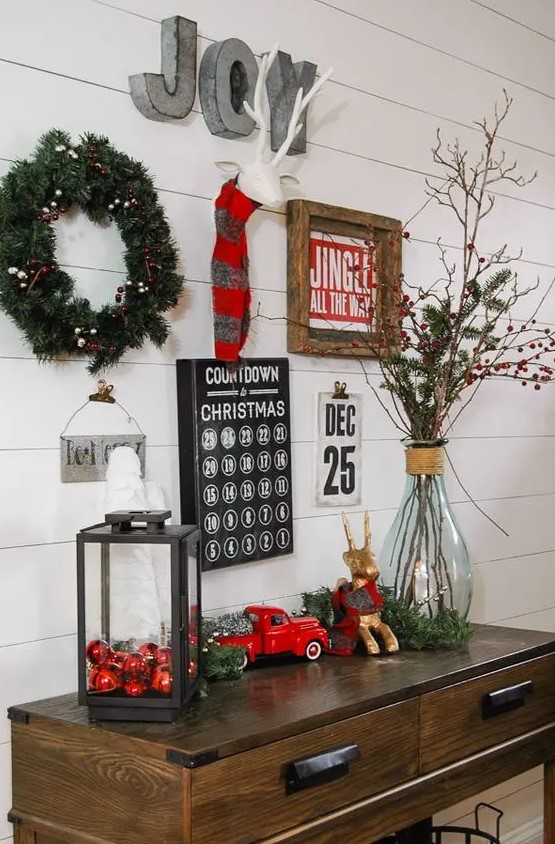 a bright gallery wall with an advent calendar, signs, metal letters and a wreath to count down to Christmas