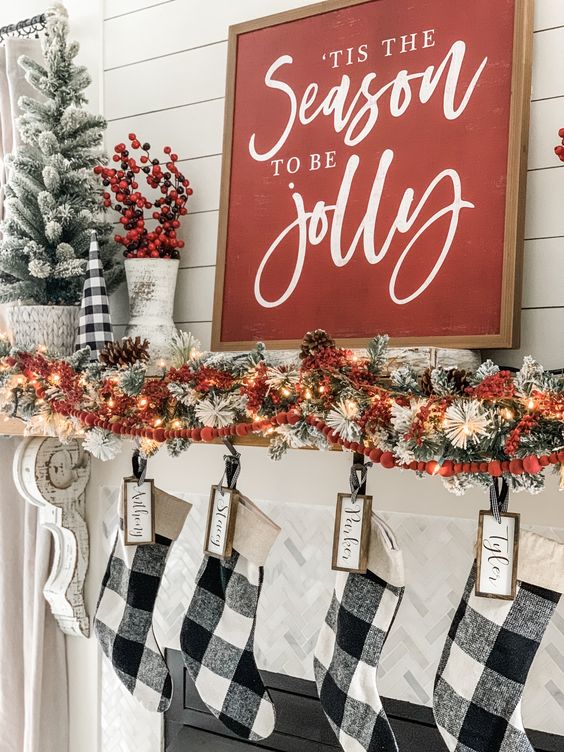a classic red Christmas sign with white calligraphy is always a good idea for most of farmhouse-inspried interiors