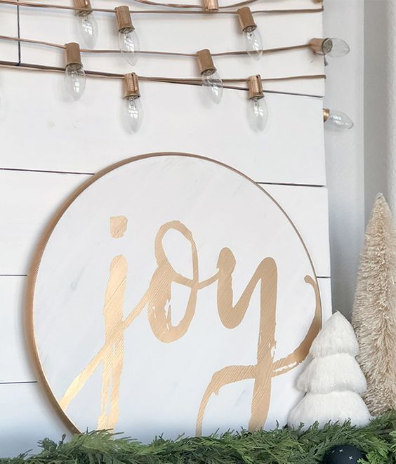 a classy modern gold and white round calligraphy sign will be an amazing idea for Christmas