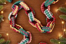 a colorful knit chain garland is a pretty and bold addition to your decor, especially if you love bold colors
