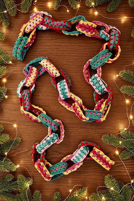 a colorful knit chain garland is a pretty and bold addition to your decor, especially if you love bold colors