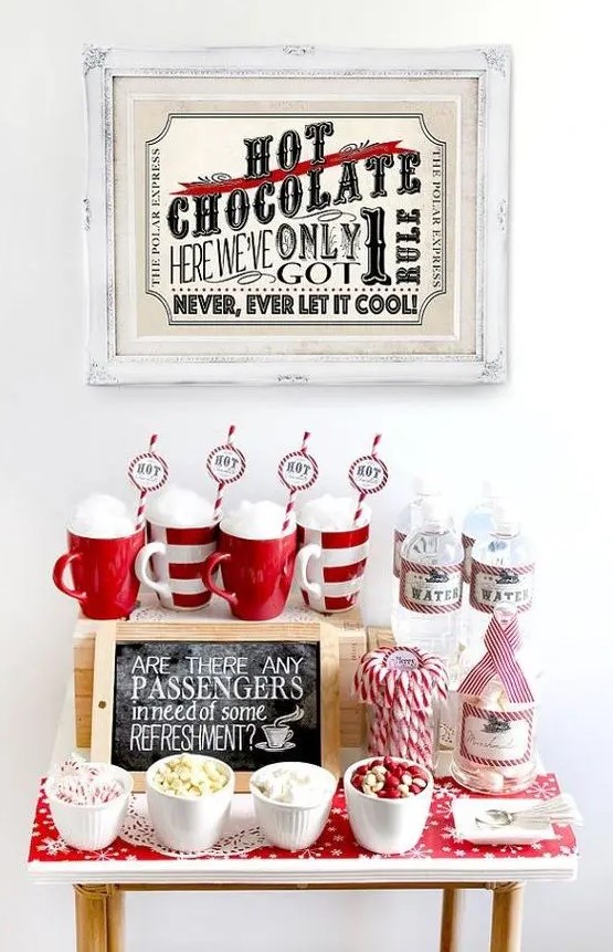 a gorgeous festive hot chocolate station with sweets done in traditional red and white