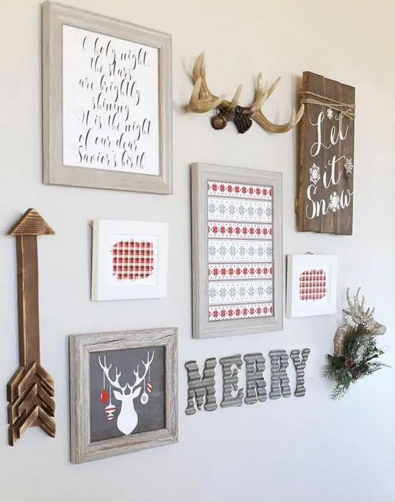 a holiday gallery wall with signs, letters, artworks, a fake deer head and an arrow for Christmas