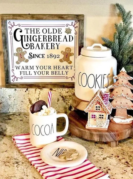 a little gingerbread station with a gingerbread tree and house plus a vintage sign
